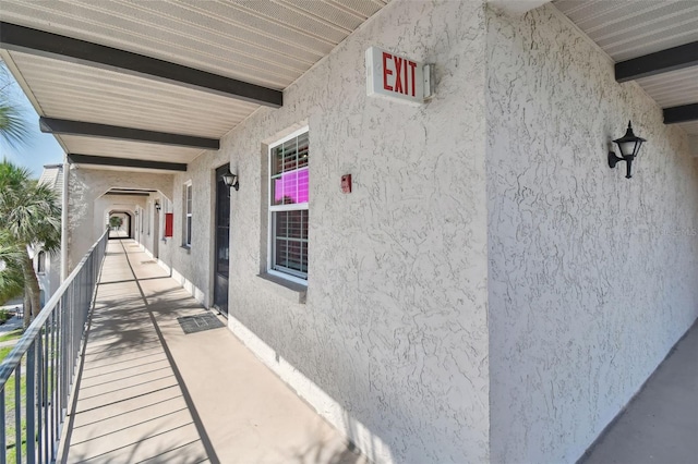 entrance to property with a balcony