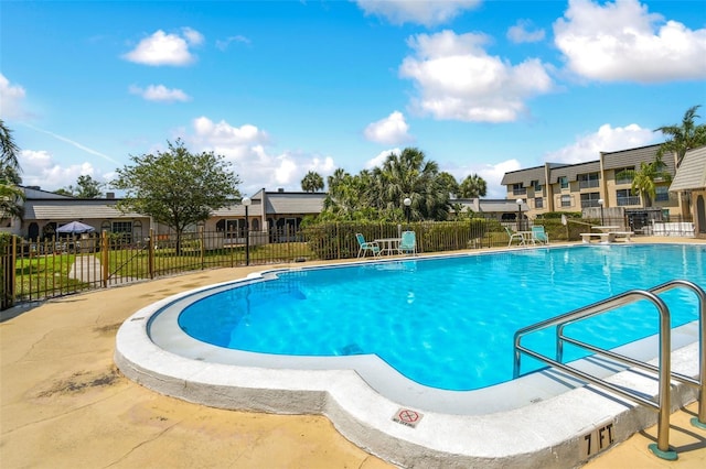 view of swimming pool with a patio