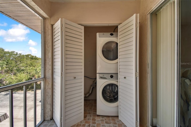 washroom with stacked washer / dryer