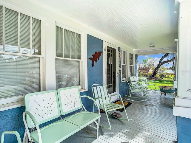 wooden deck featuring a porch