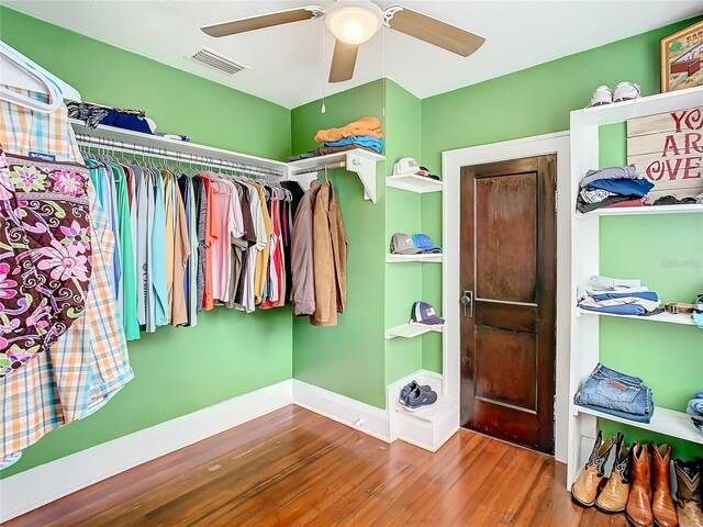 walk in closet featuring hardwood / wood-style floors