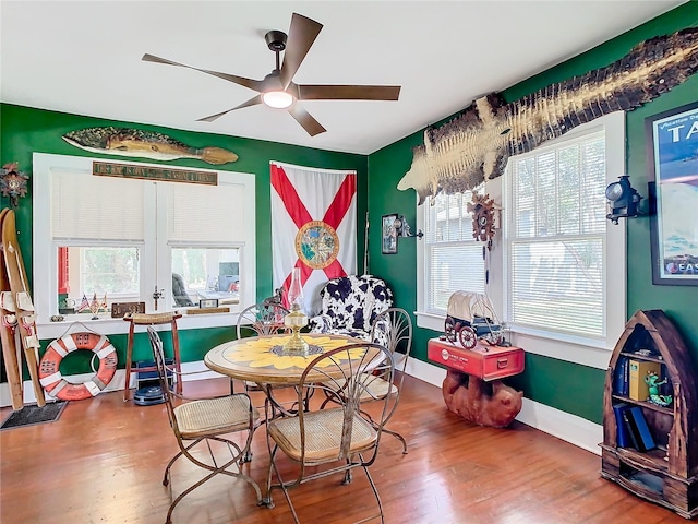 rec room featuring hardwood / wood-style flooring, ceiling fan, and french doors