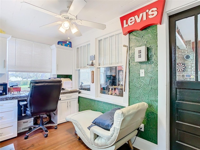 office space with ceiling fan and light wood-type flooring