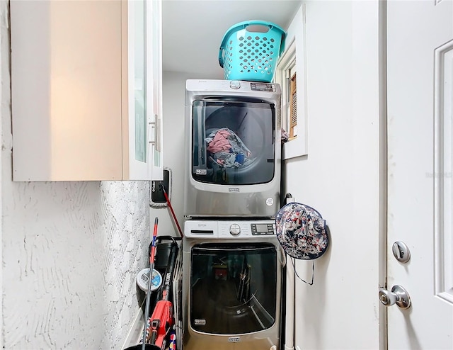 laundry area featuring stacked washer and dryer