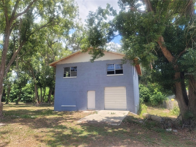 view of side of home featuring a garage