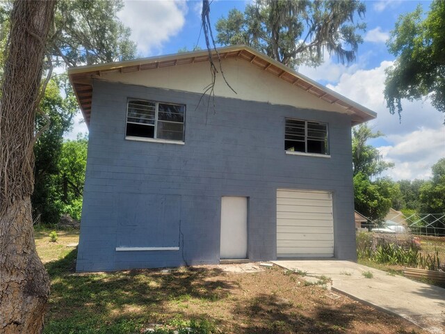 view of property exterior featuring a garage