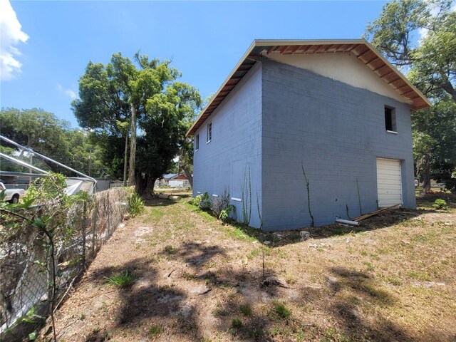 view of side of property featuring a garage