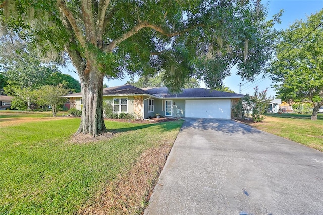 single story home with a garage and a front yard