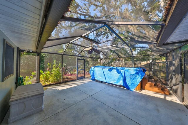 view of patio / terrace featuring glass enclosure