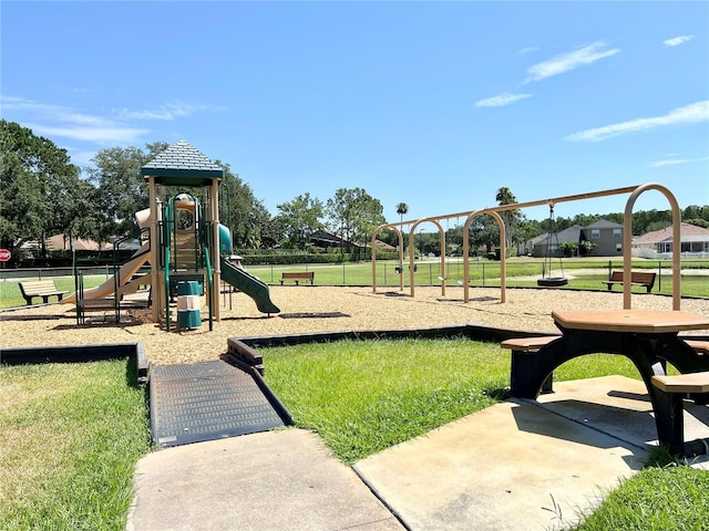 view of playground featuring a lawn