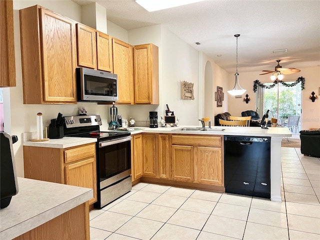 kitchen featuring ceiling fan, light tile patterned flooring, sink, and appliances with stainless steel finishes