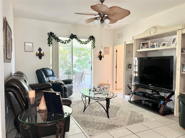 tiled living room featuring ceiling fan