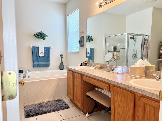 bathroom featuring tile patterned floors, vanity, and independent shower and bath