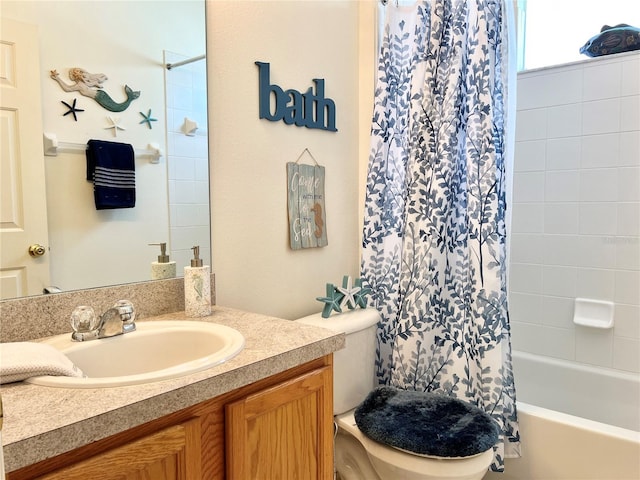 full bathroom featuring vanity, shower / bath combination with curtain, and toilet