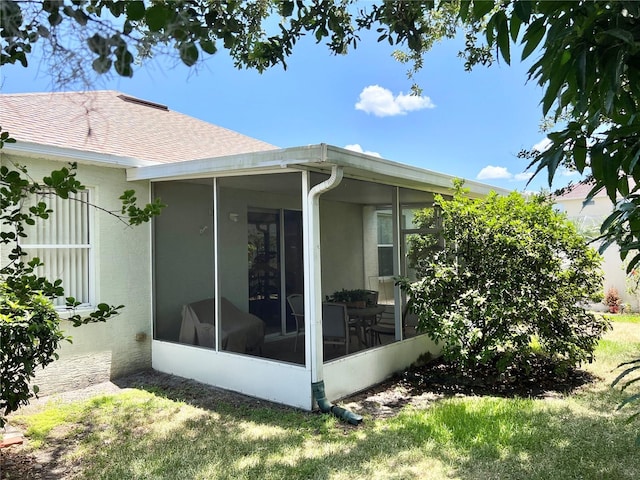 view of home's exterior featuring a sunroom