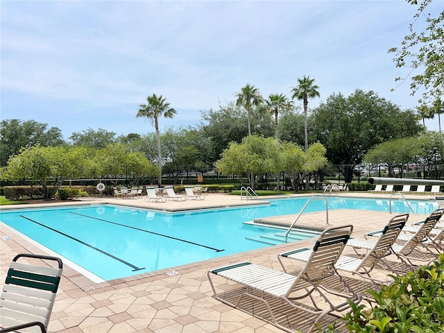 view of pool featuring a patio area