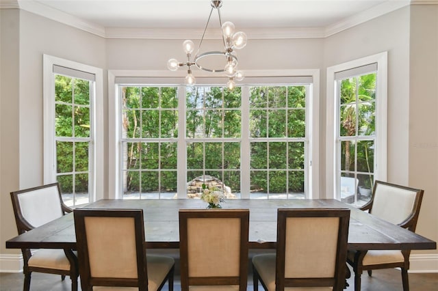 dining area with crown molding, a wealth of natural light, and an inviting chandelier