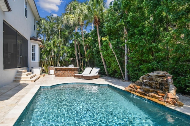 view of swimming pool featuring a patio