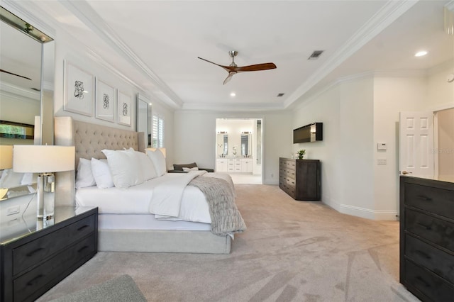 carpeted bedroom featuring ceiling fan, a tray ceiling, and crown molding