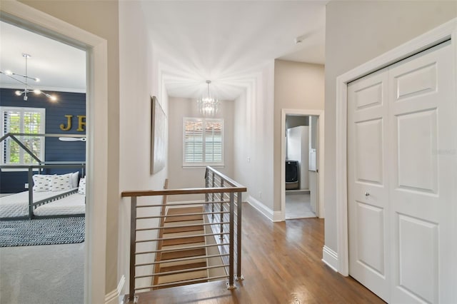 entryway featuring an inviting chandelier and hardwood / wood-style floors