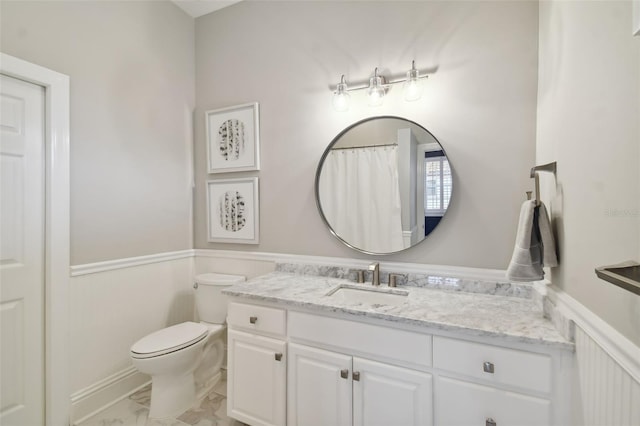 bathroom with tile floors, oversized vanity, and toilet