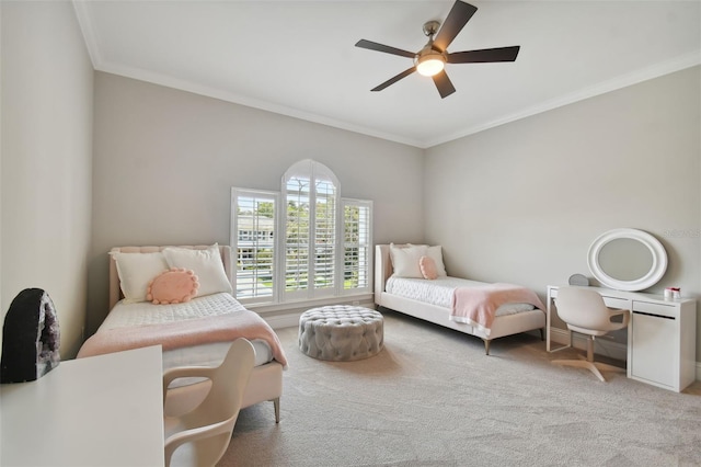 bedroom featuring crown molding, carpet, and ceiling fan