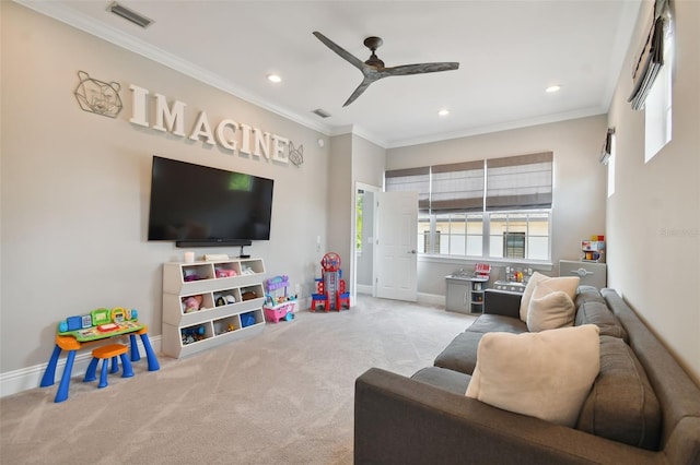 carpeted living room with ceiling fan and crown molding