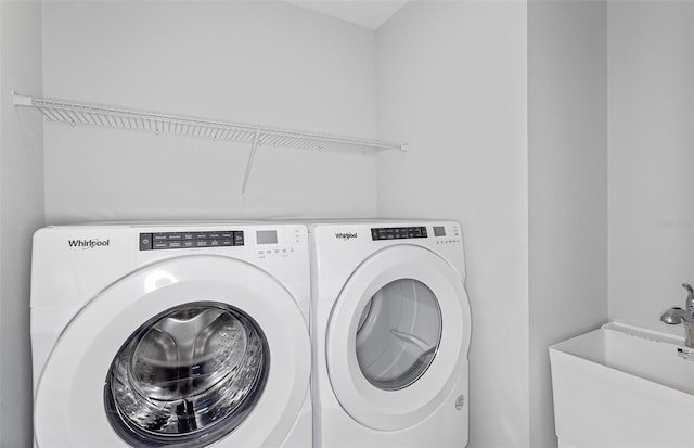 laundry area with sink and washer and dryer