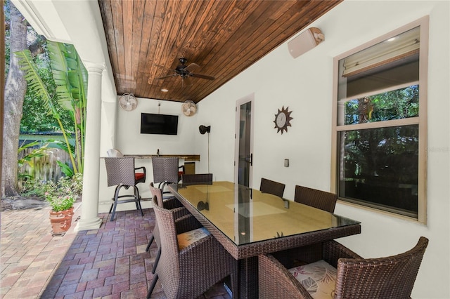 view of patio / terrace featuring exterior bar and ceiling fan