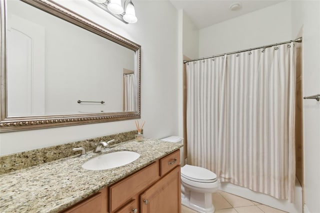 full bathroom featuring vanity, shower / tub combo with curtain, tile patterned floors, and toilet