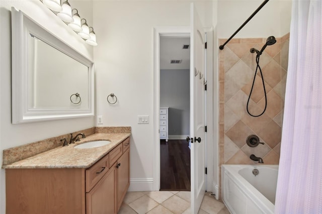 bathroom featuring shower / bath combo, tile patterned floors, and vanity