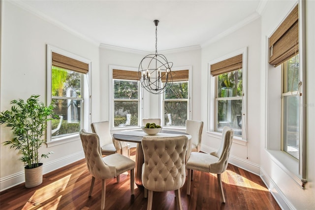 dining room featuring crown molding, dark wood-type flooring, an inviting chandelier, and baseboards