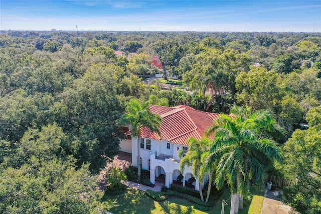 drone / aerial view with a view of trees