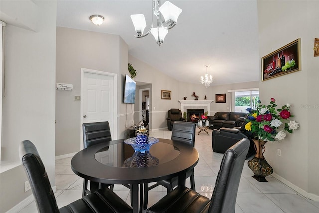 dining space featuring vaulted ceiling, light tile patterned floors, and a chandelier