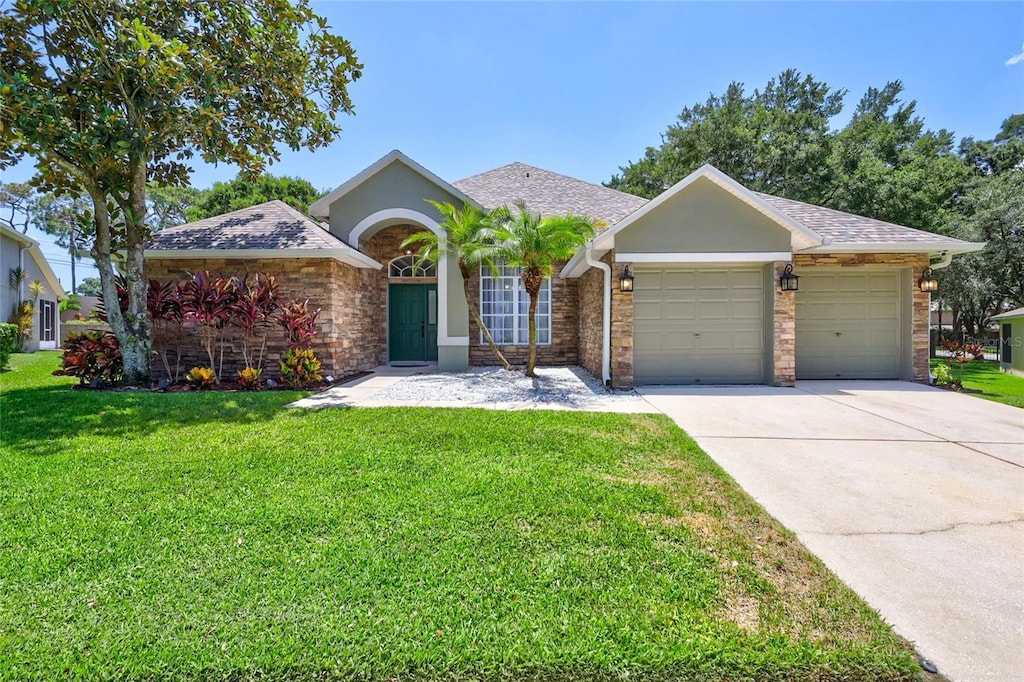 ranch-style house with a garage and a front lawn