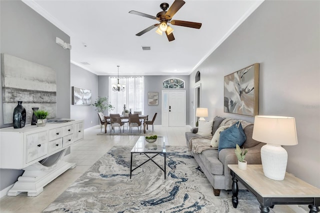 tiled living room featuring ceiling fan with notable chandelier and ornamental molding