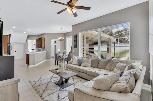 805 Woodcarver Ln, Brandon, FL 33510 - living room featuring ceiling fan, a chandelier, arched walkways, light tile patterned floors, and recessed lighting