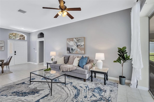 805 Woodcarver Ln, Brandon, FL 33510 - living area with ceiling fan, light tile patterned floors, and arched walkways