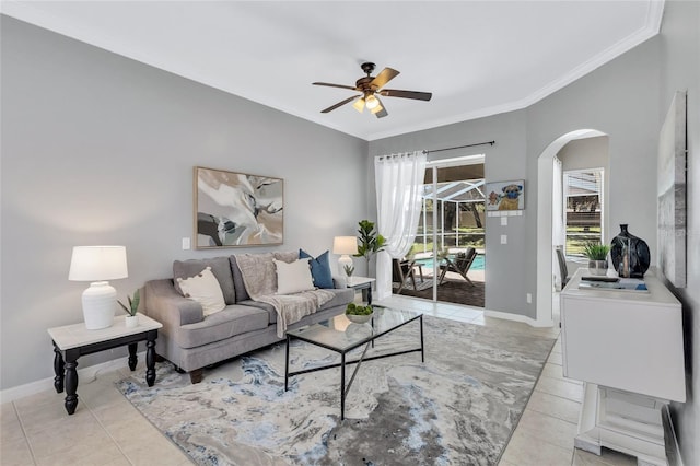 805 Woodcarver Ln, Brandon, FL 33510 - living room featuring arched walkways, ceiling fan, light tile patterned floors, and ornamental molding