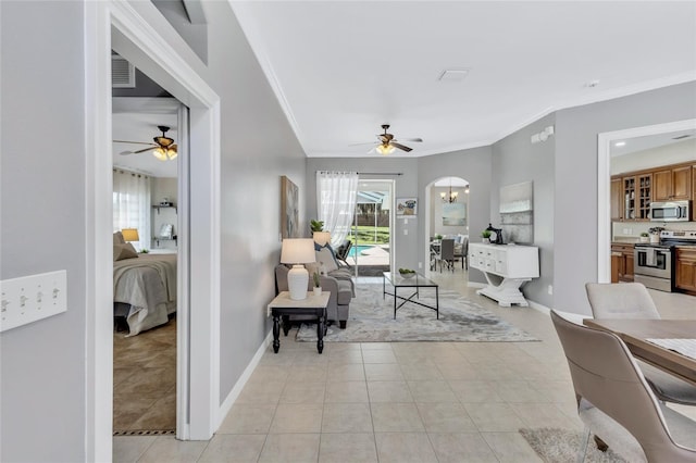 805 Woodcarver Ln, Brandon, FL 33510 - living area featuring a ceiling fan, ornamental molding, plenty of natural light, and light tile patterned flooring