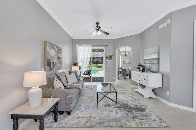 805 Woodcarver Ln, Brandon, FL 33510 - living area featuring ornamental molding, arched walkways, a ceiling fan, light tile patterned floors, and a chandelier