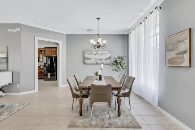 805 Woodcarver Ln, Brandon, FL 33510 - dining room with a chandelier, light tile patterned flooring, and ornamental molding