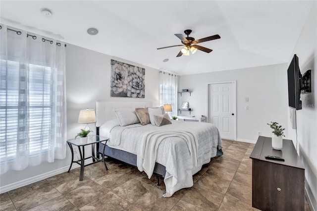 805 Woodcarver Ln, Brandon, FL 33510 - bedroom with multiple windows, a ceiling fan, and lofted ceiling