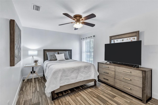 805 Woodcarver Ln, Brandon, FL 33510 - bedroom featuring light wood finished floors and a ceiling fan