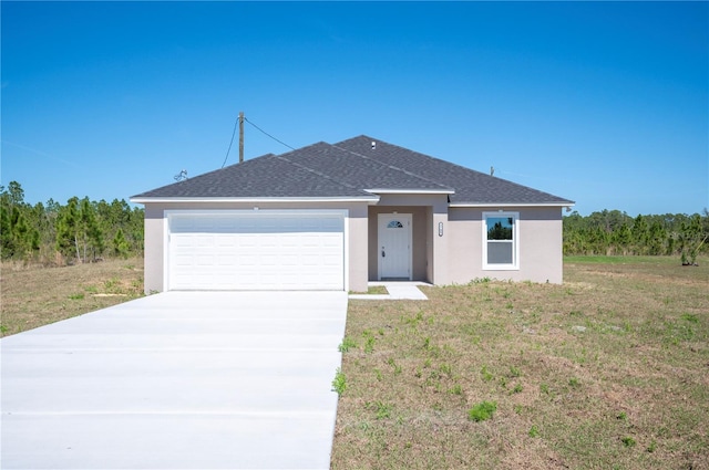 view of front of home with stucco siding, a shingled roof, an attached garage, a front yard, and driveway