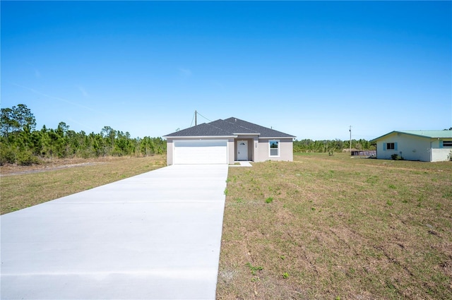 ranch-style home with driveway, a front lawn, and an attached garage