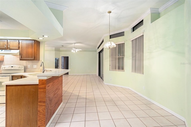 kitchen with electric range, sink, kitchen peninsula, pendant lighting, and light tile patterned flooring