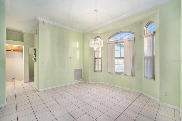 tiled empty room featuring crown molding and a chandelier