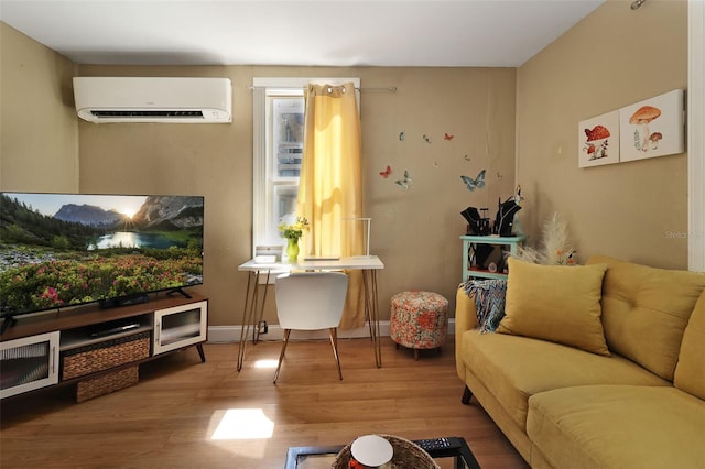 living room featuring wood-type flooring and an AC wall unit