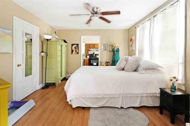 bedroom featuring hardwood / wood-style flooring and ceiling fan